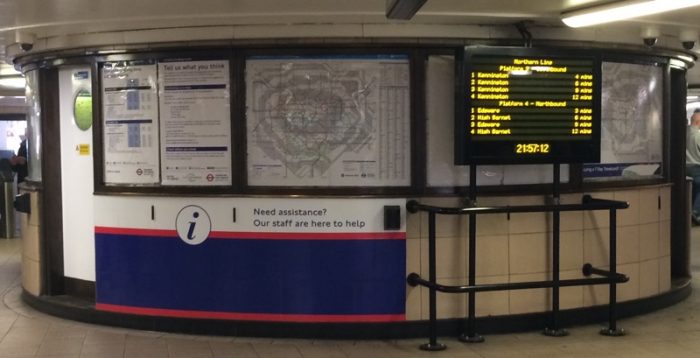 Rotunda in Leicester Square station ticket hall in 2019. A map, and information displays.